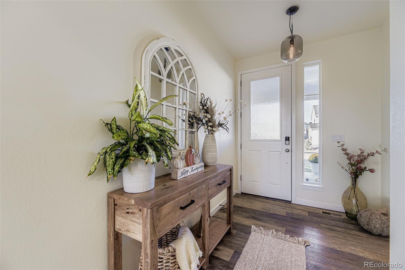 1126 Williams Loop Elizabeth, CO 80107 - Photo 6 of 50 a view of entryway with wooden floor