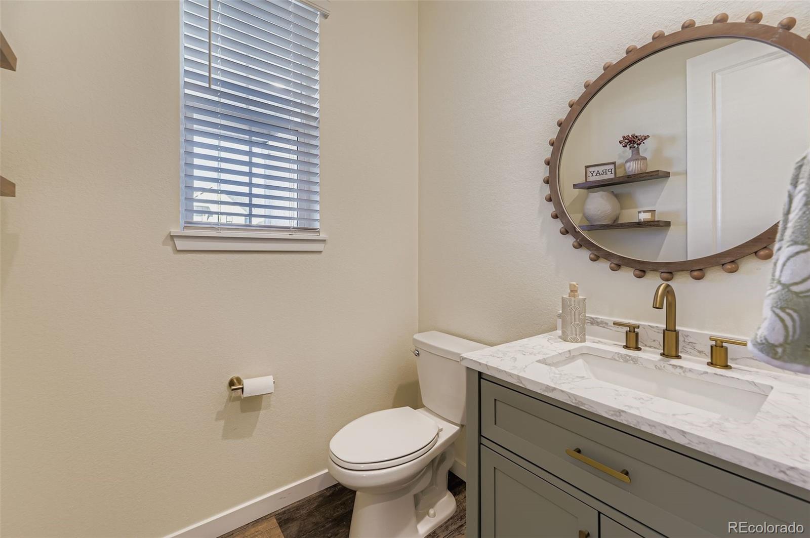 1126 Williams Loop Elizabeth, CO 80107 - Photo 7 of 50 a bathroom with a sink and a mirror