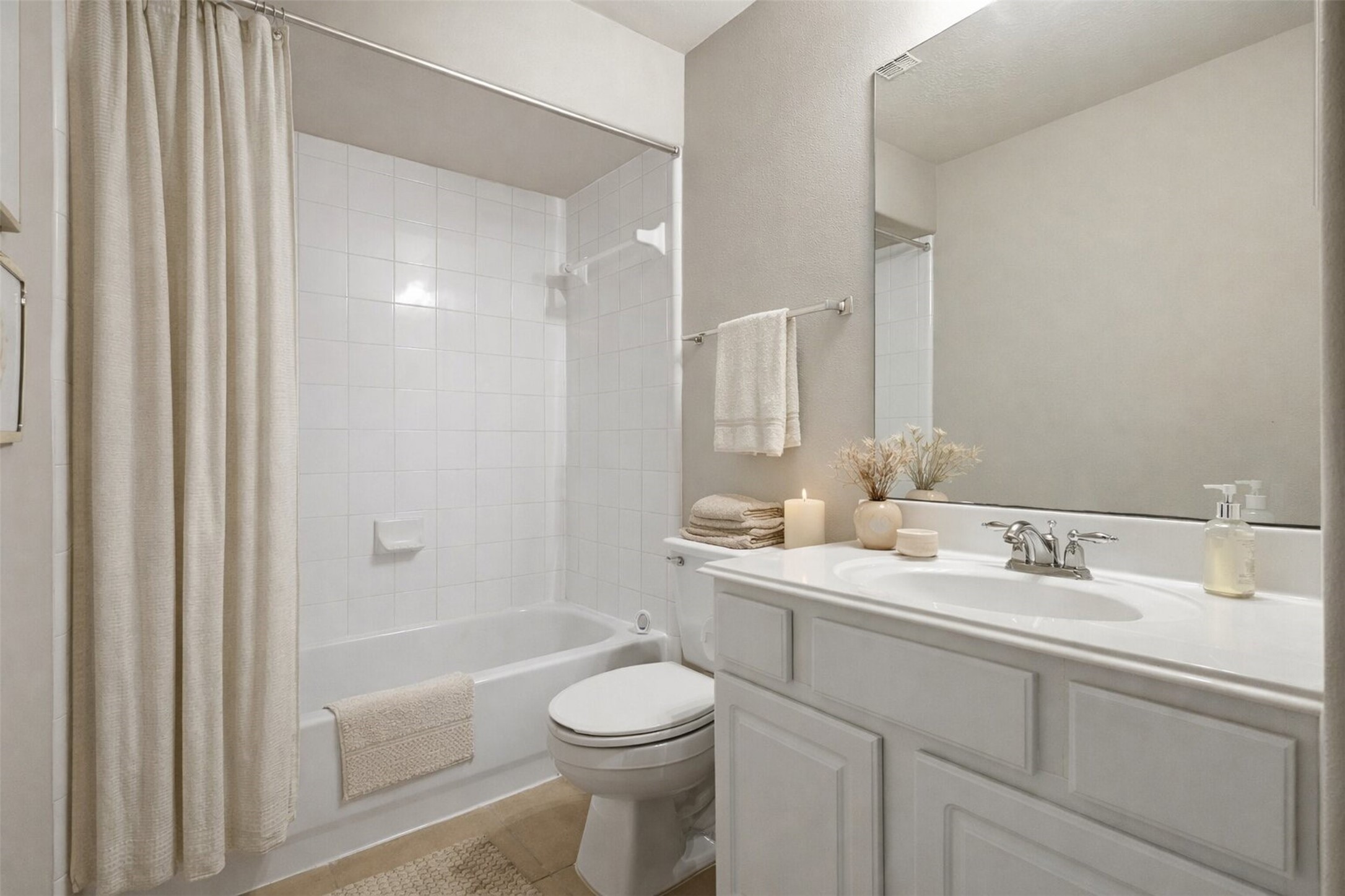 17406 North Riata Lake Cypress, TX 77433 - Photo 17 of 33 Full secondary bath with a tub-shower combination and clean, functional finishes (virtually staged).