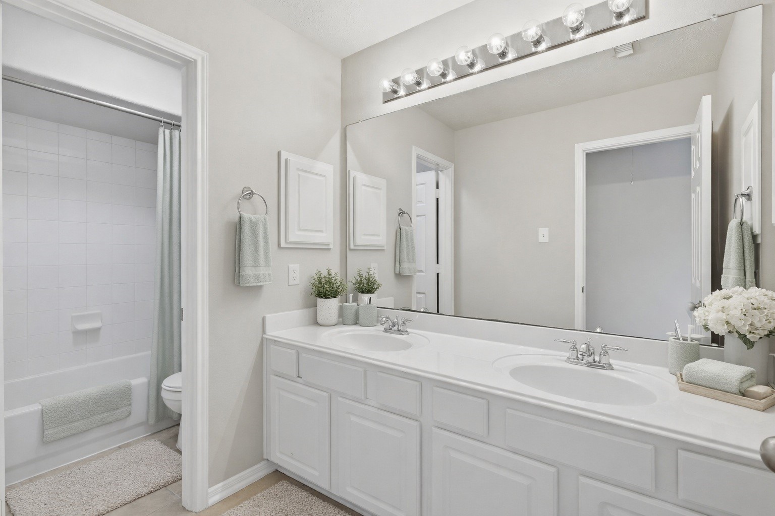 17406 North Riata Lake Cypress, TX 77433 - Photo 20 of 33 Secondary bath with dual sinks, generous vanity space, and convenient bedroom access (virtually staged).