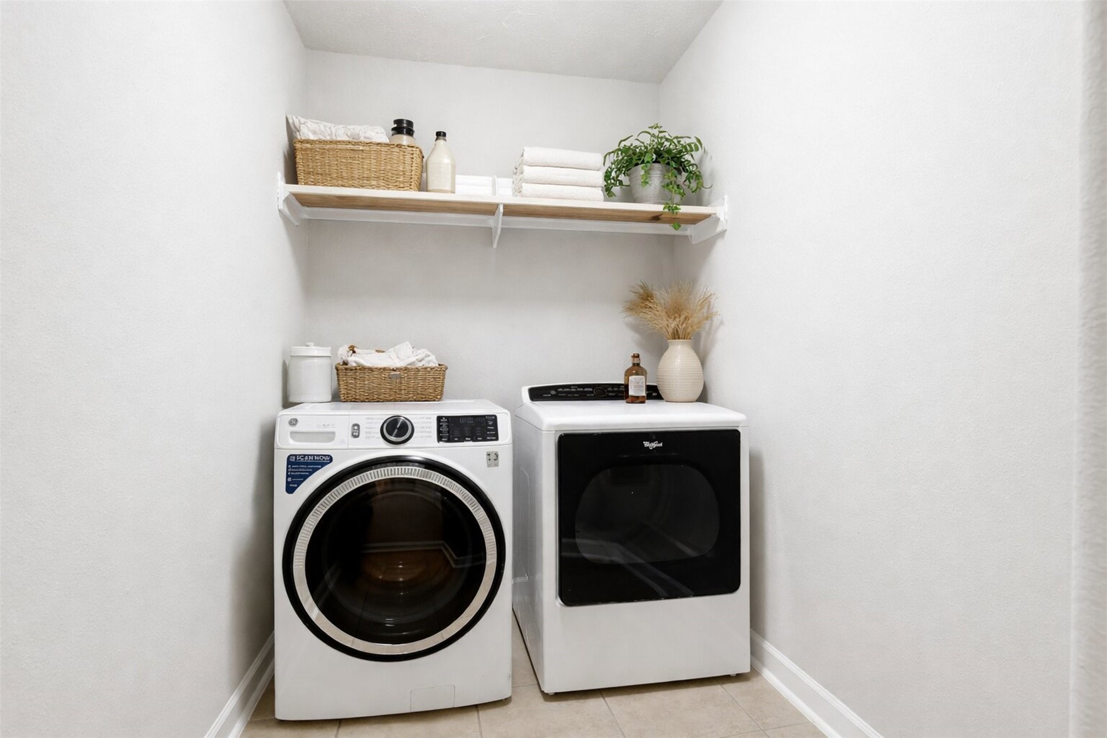 17406 North Riata Lake Cypress, TX 77433 - Photo 21 of 33 Functional laundry room with built-in shelving and space for organization (virtually staged).