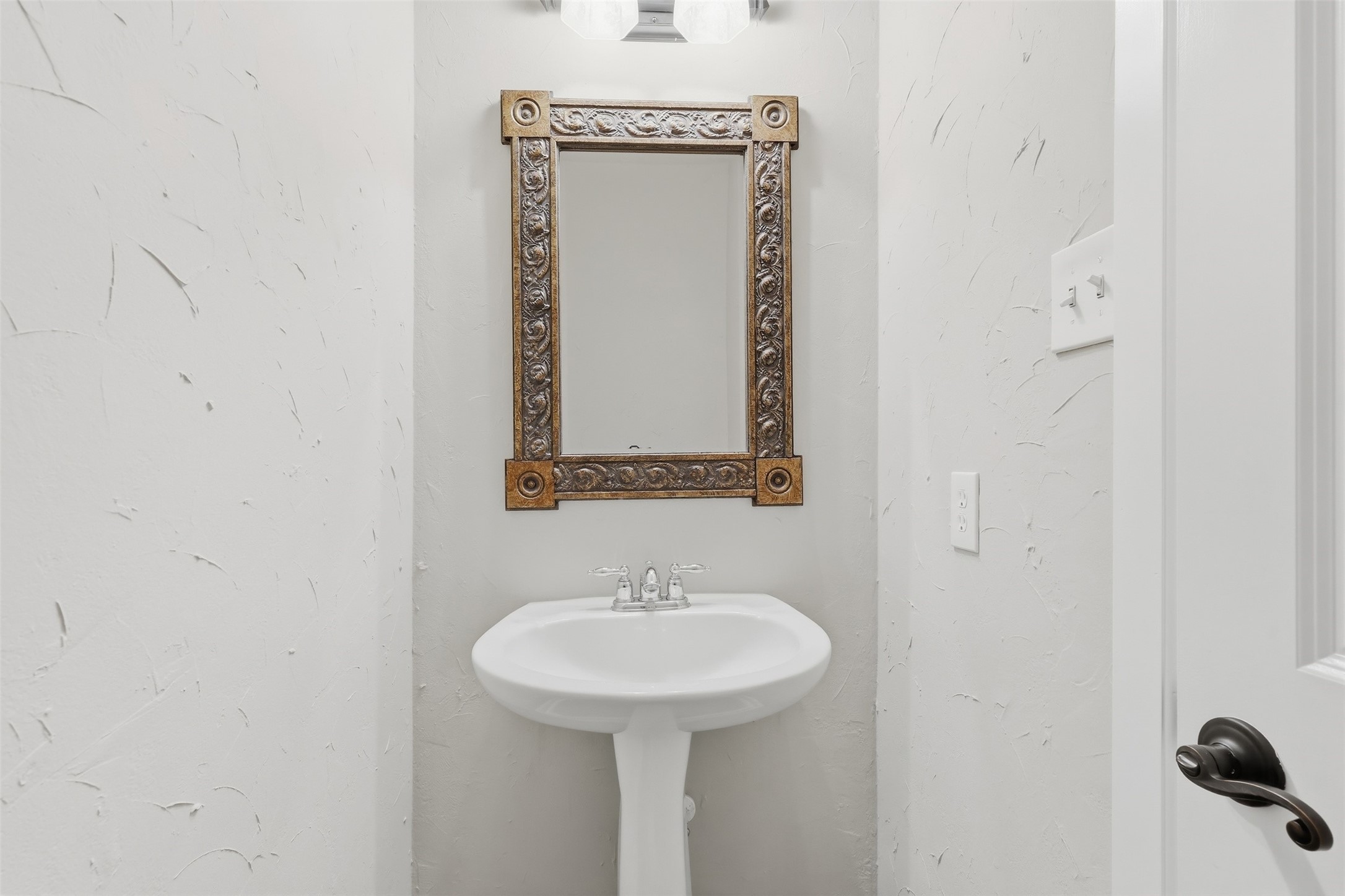 17406 North Riata Lake Cypress, TX 77433 - Photo 22 of 33 Convenient powder bath on the main level for guests.