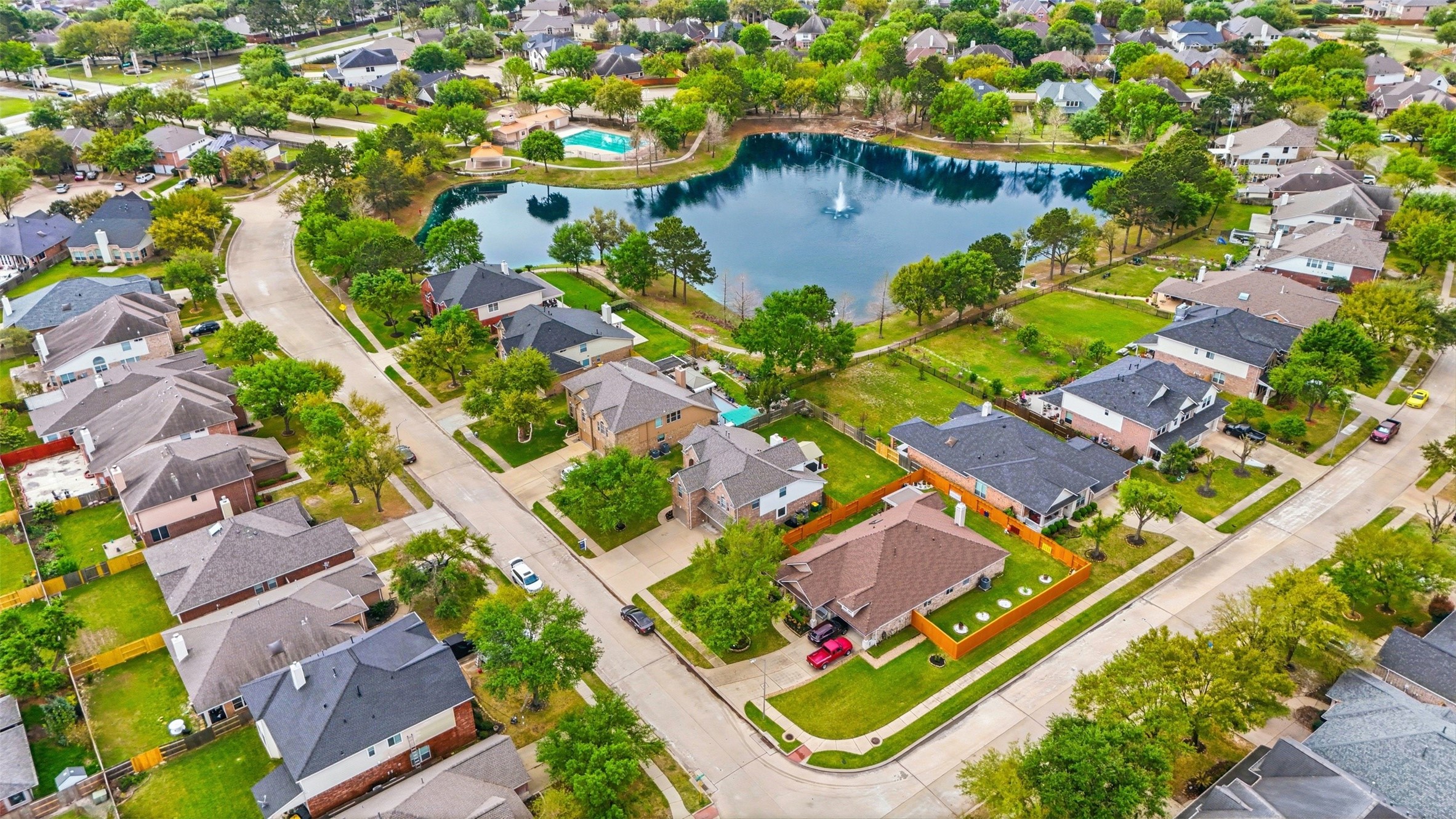 17406 North Riata Lake Cypress, TX 77433 - Photo 27 of 33 Wide community aerial featuring the surrounding neighborhood, lake, and amenity-rich setting.