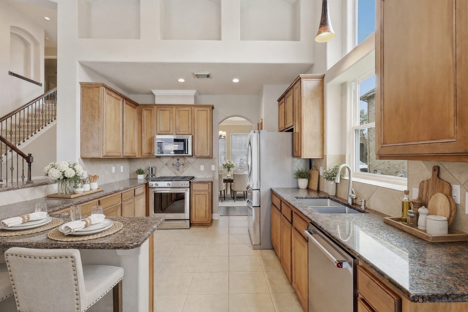 17406 North Riata Lake Cypress, TX 77433 - Photo 6 of 33 Well-appointed kitchen with granite countertops, abundant cabinetry, and an open, airy design (virtually staged).
