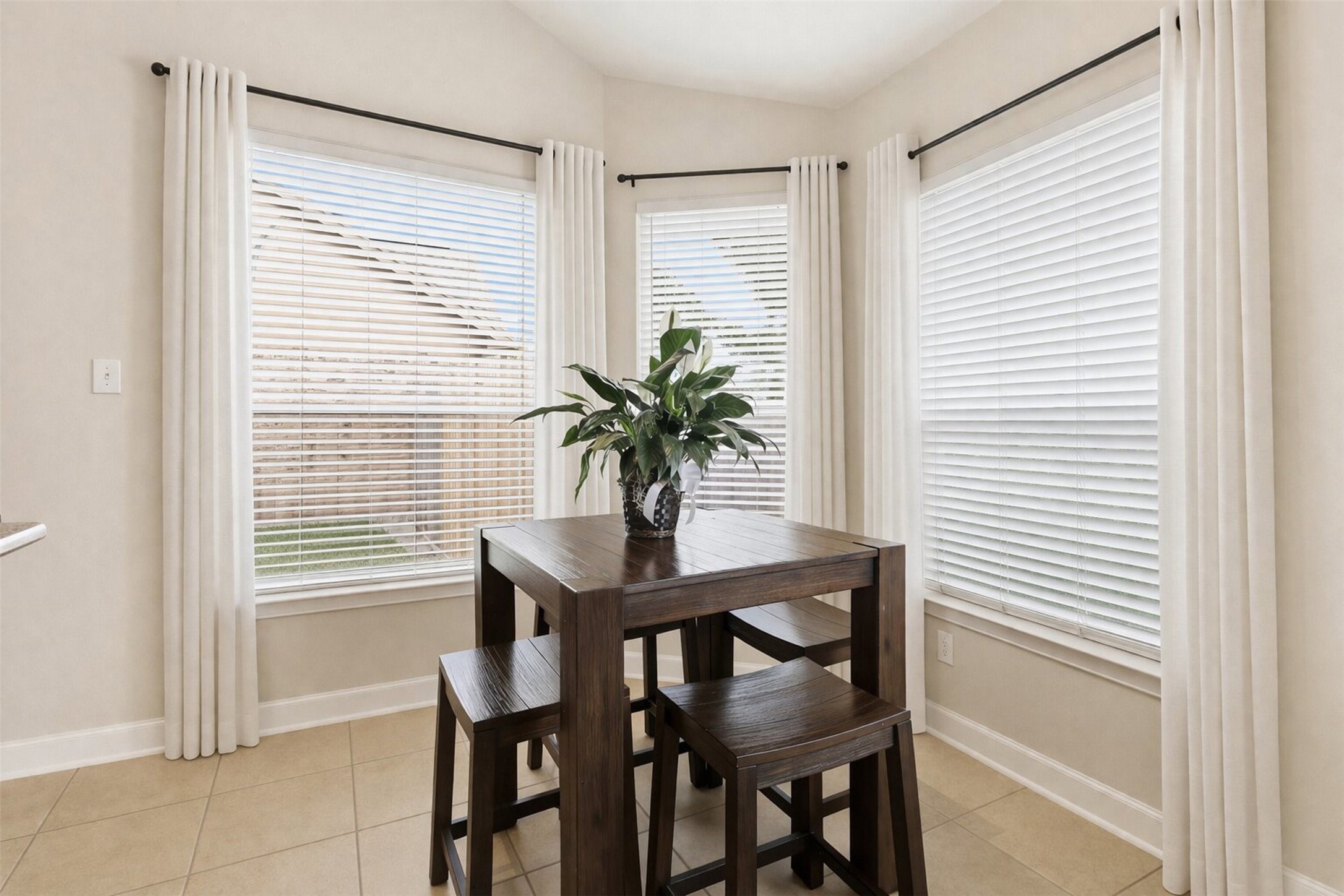 17406 North Riata Lake Cypress, TX 77433 - Photo 8 of 33 Sunny breakfast area framed by windows, ideal for casual dining and everyday living.