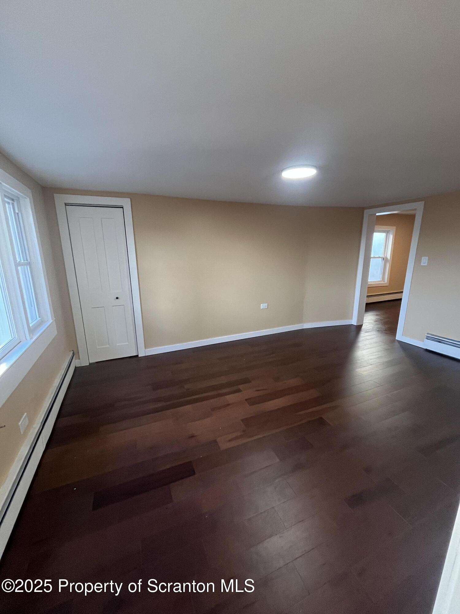 129 South Blakely Street, Unit 2 Dunmore, PA 18512 - Photo 5 of 10 a view of an empty room and window