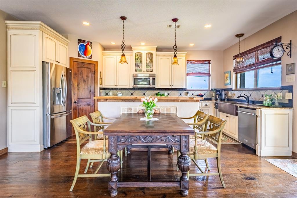 7060 Hells Gate Loop Strawn, TX 76475 - Photo 5 of 40 a view of a dining room with furniture