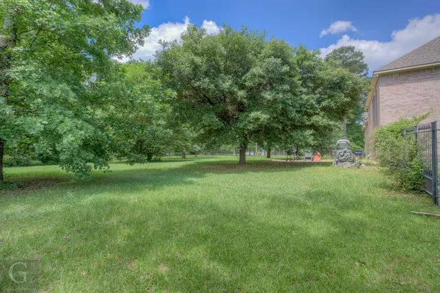 a view of outdoor space with deck and yard