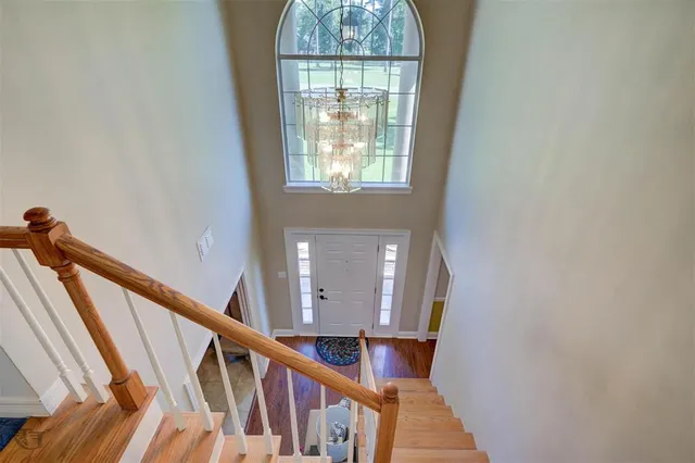 a view of an entryway with wooden floor