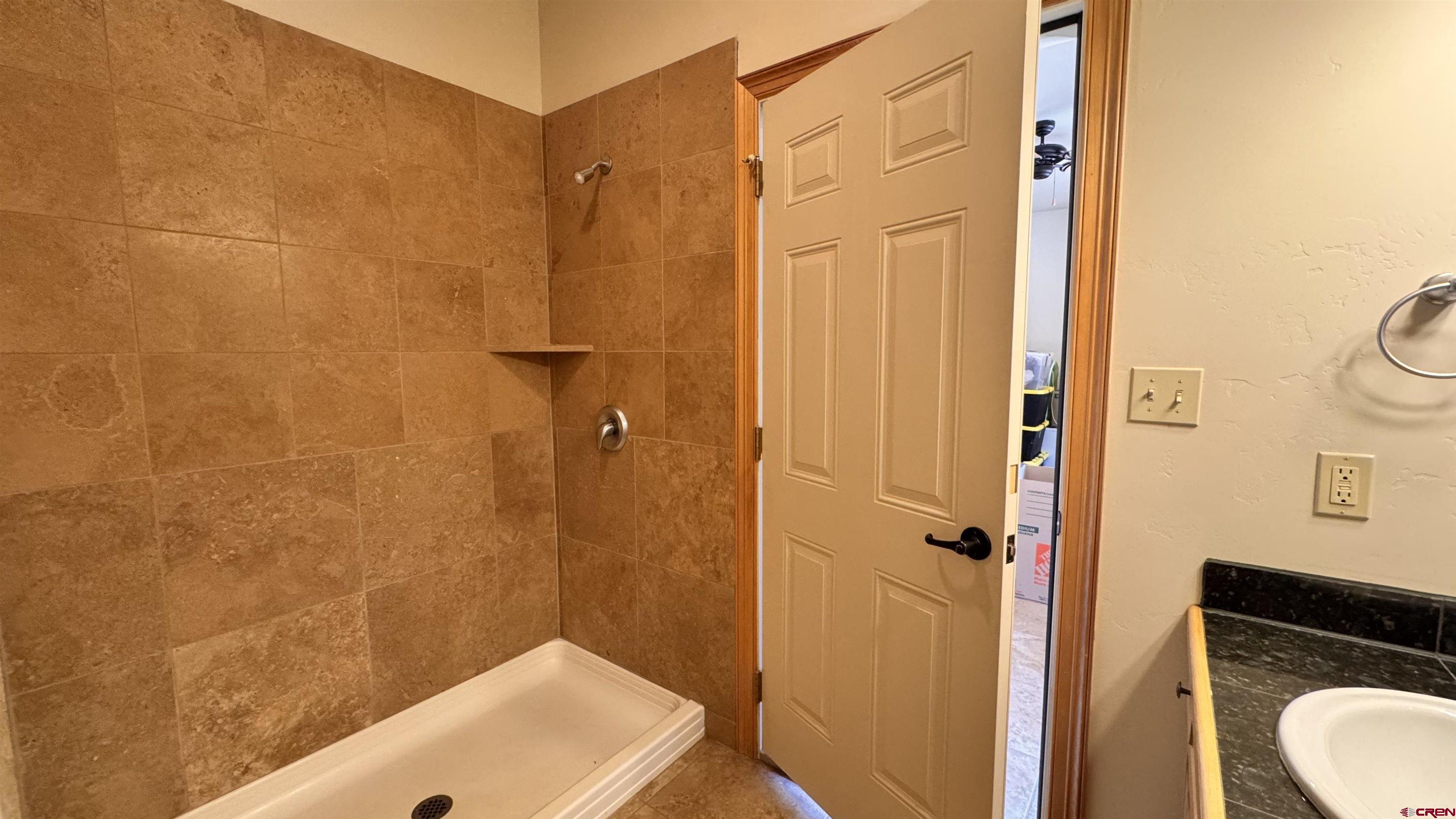 1422 Animas View Drive, Unit 55 Durango, CO 81301 - Photo 38 of 45 a bathroom with a shower and a sink