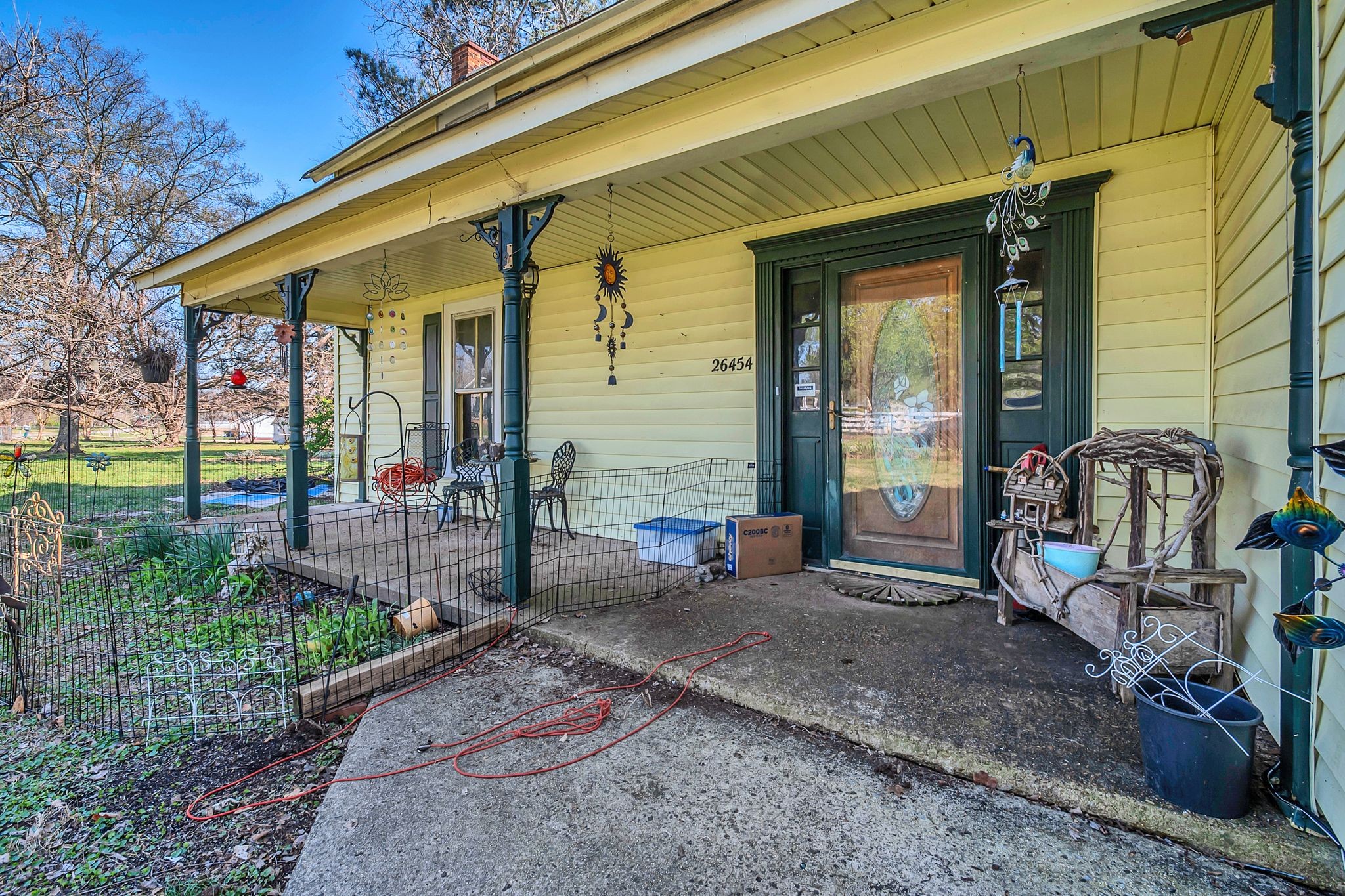 26454 Austin Whitt Road Ardmore, TN 38449 - Photo 11 of 49 a front view of a house with garden