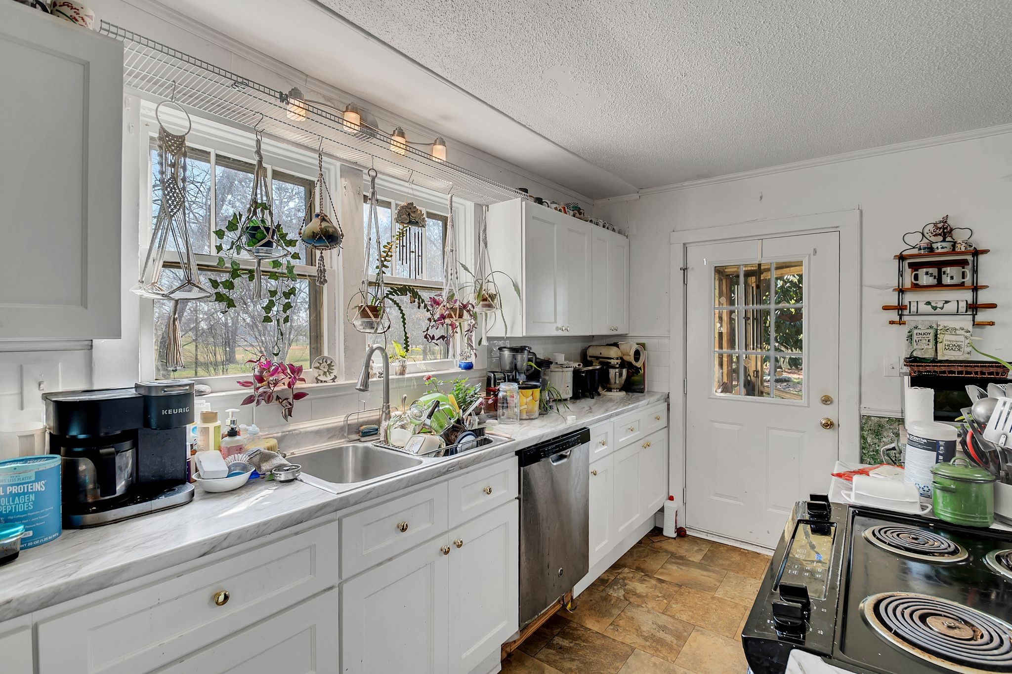 26454 Austin Whitt Road Ardmore, TN 38449 - Photo 23 of 49 a kitchen with a sink stove and cabinets