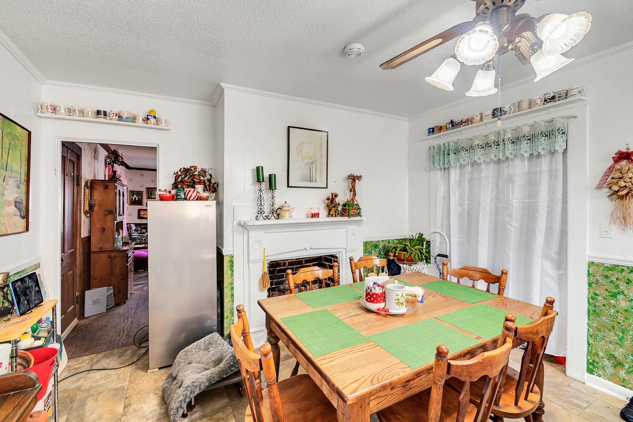26454 Austin Whitt Road Ardmore, TN 38449 - Photo 25 of 49 a view of a dining room with furniture a chandelier and a window