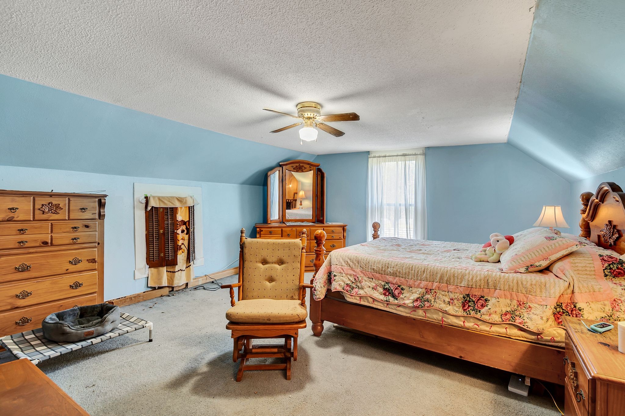 26454 Austin Whitt Road Ardmore, TN 38449 - Photo 28 of 49 a bedroom with a bed and a chandelier