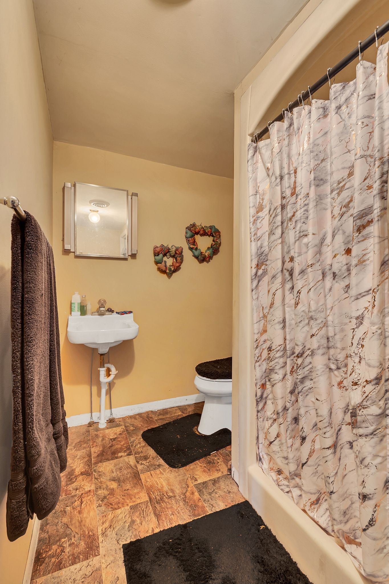 26454 Austin Whitt Road Ardmore, TN 38449 - Photo 32 of 49 a bathroom with a sink and a mirror