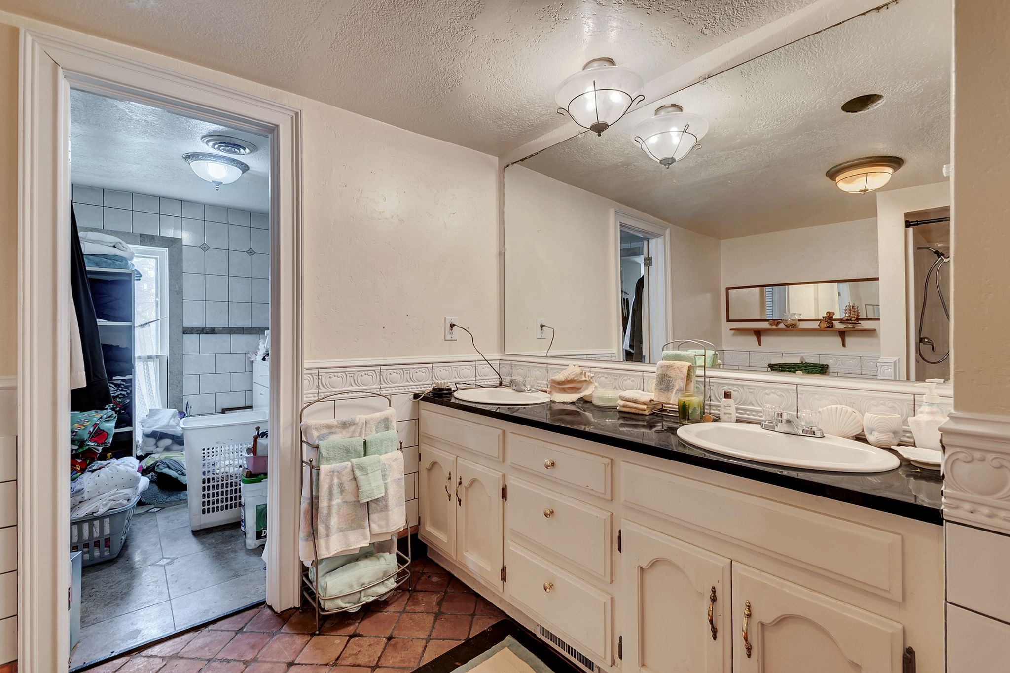 26454 Austin Whitt Road Ardmore, TN 38449 - Photo 38 of 49 a bathroom with a double vanity sink and a mirror