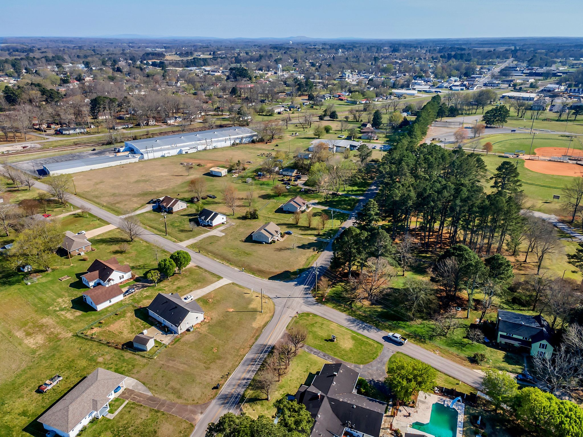26454 Austin Whitt Road Ardmore, TN 38449 - Photo 6 of 49 an aerial view of residential houses with outdoor space