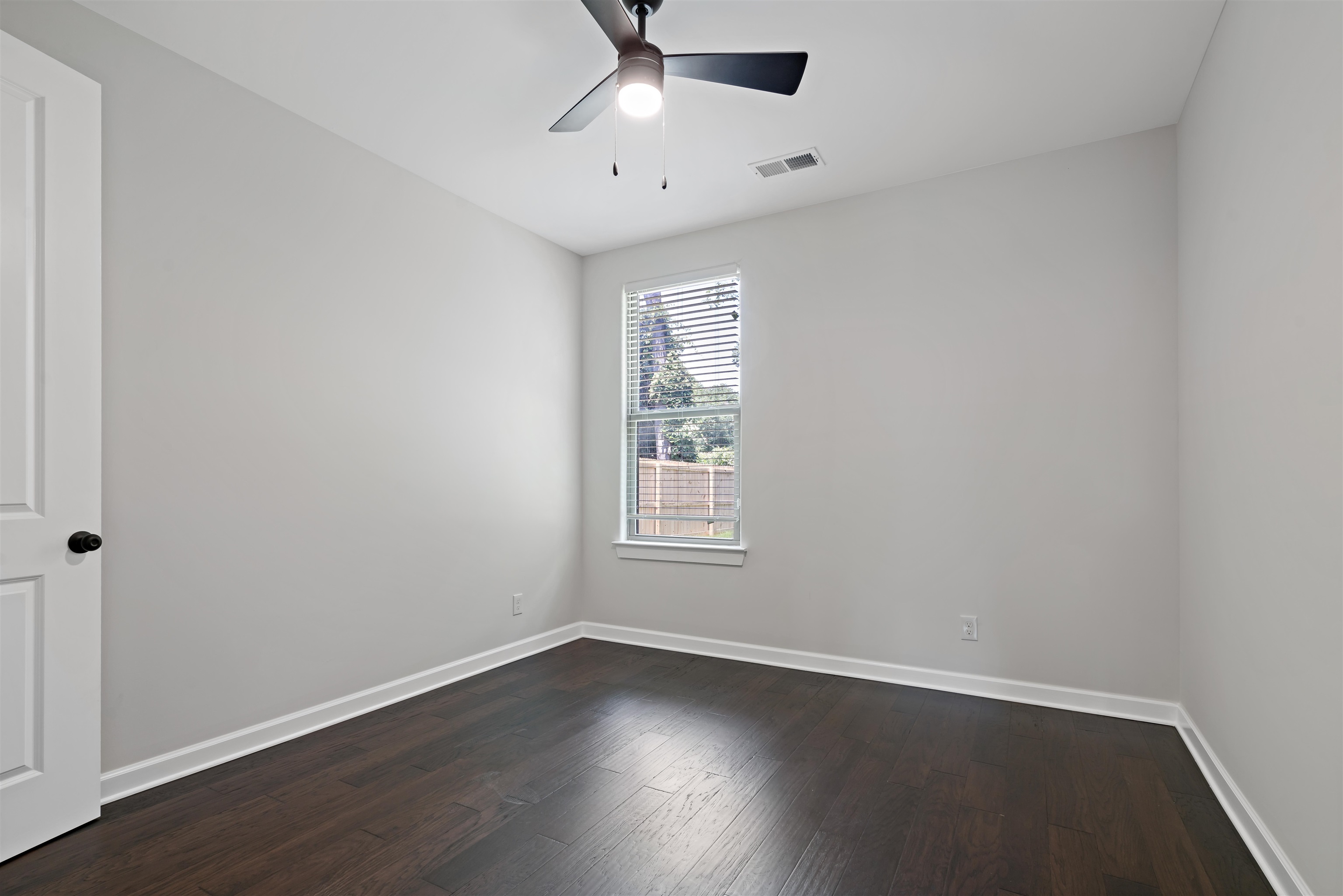 694 Brownlee Road Memphis, TN 38116 - Photo 12 of 15 Unfurnished room with ceiling fan and hardwood / wood-style flooring