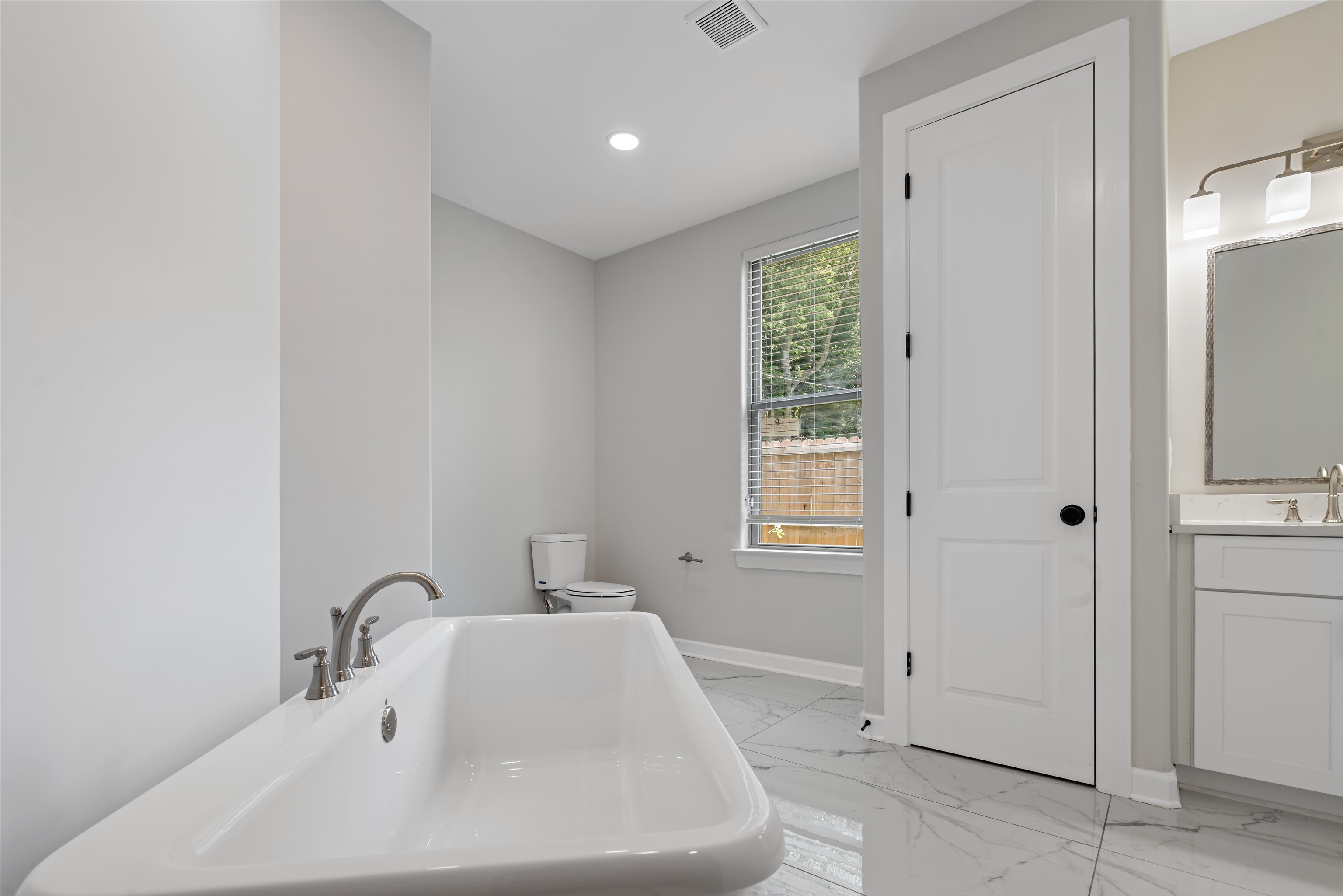 694 Brownlee Road Memphis, TN 38116 - Photo 15 of 15 Bathroom featuring vanity, toilet, and tile patterned flooring