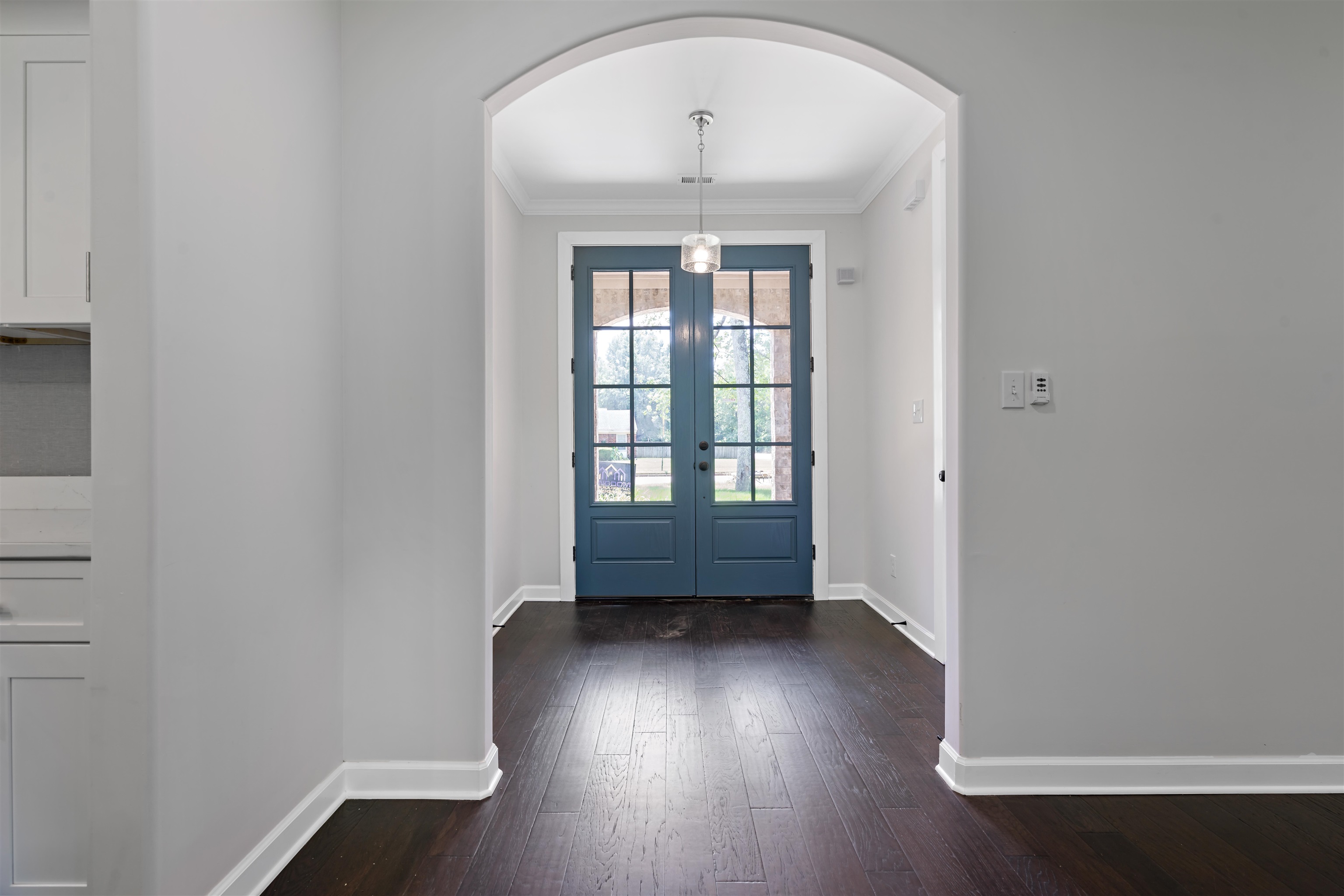 694 Brownlee Road Memphis, TN 38116 - Photo 2 of 15 Foyer entrance featuring dark hardwood / wood-style floors, french doors, and ornamental molding
