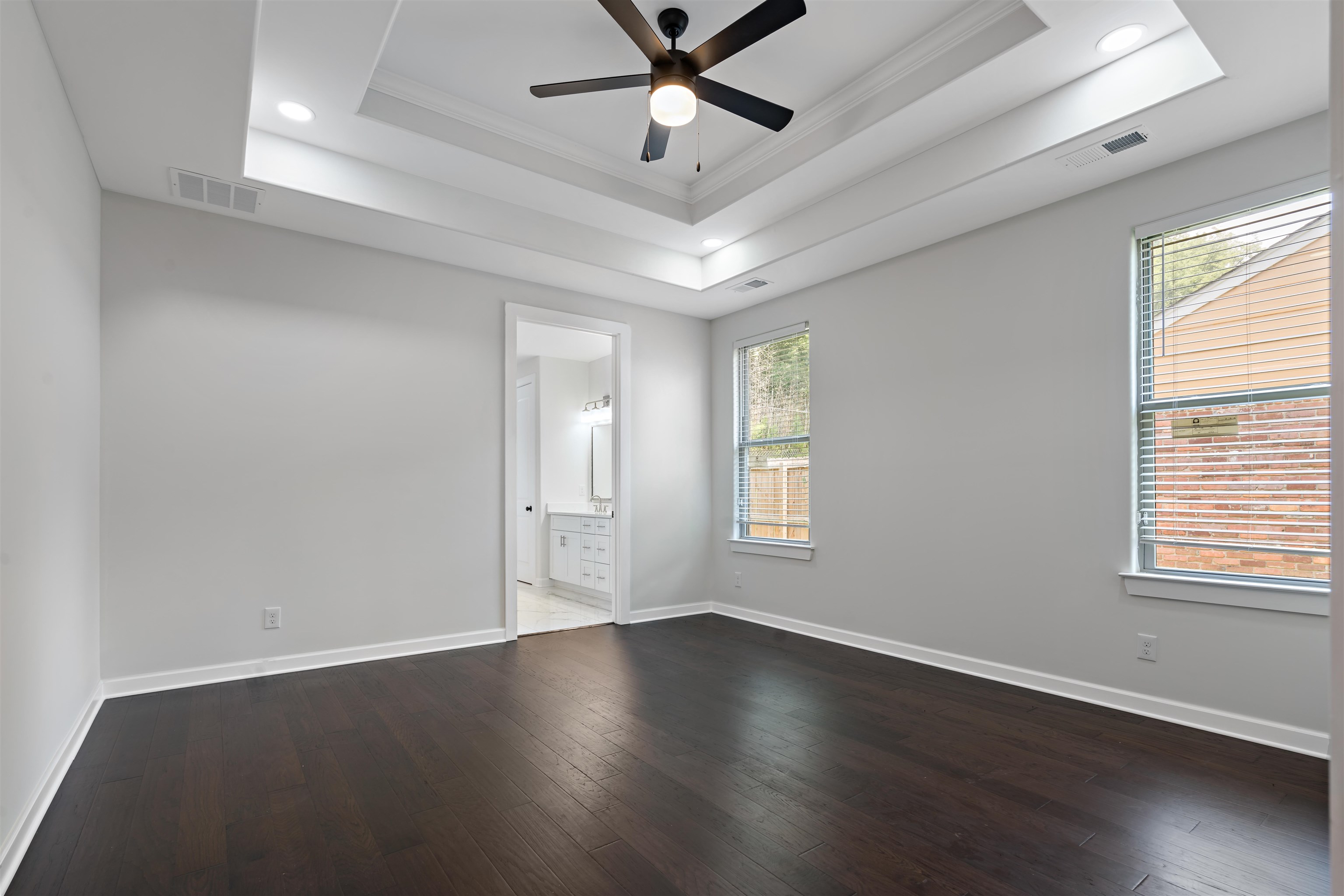 694 Brownlee Road Memphis, TN 38116 - Photo 7 of 15 Spare room with a raised ceiling, ornamental molding, hardwood / wood-style floors, and ceiling fan