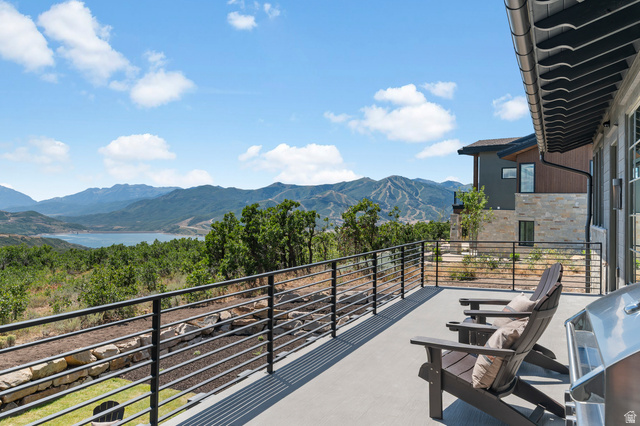 2192 East Outlaw Road Kamas, UT 84036 - Photo 63 of 80 Spacious exterior deck with a black metal railing and mountain scenery