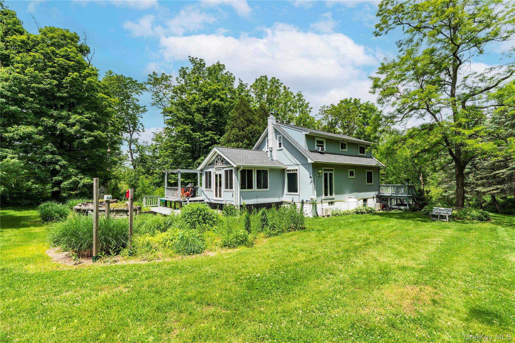 10 Pilgrims Progress Road Rhinebeck, NY 12572 - Photo 4 of 31 South Facing Back of the Home with a Waterfall and Pond