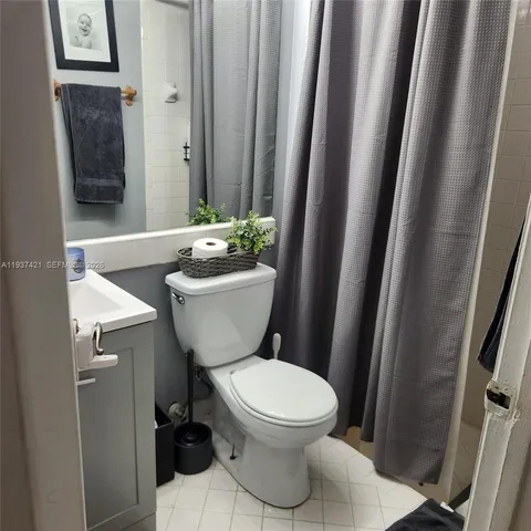 a bedroom with furniture and a gym equipment