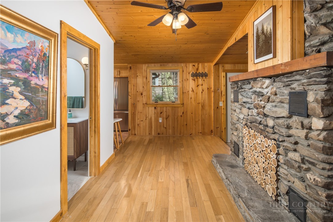 280 Chinkapin Ridge Road Seven Devils, NC 28604 - Photo 14 of 40 a view of a hallway with wooden floor and furniture