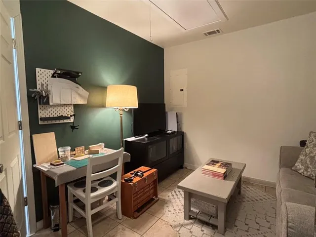 a reading room with furniture and a lamp