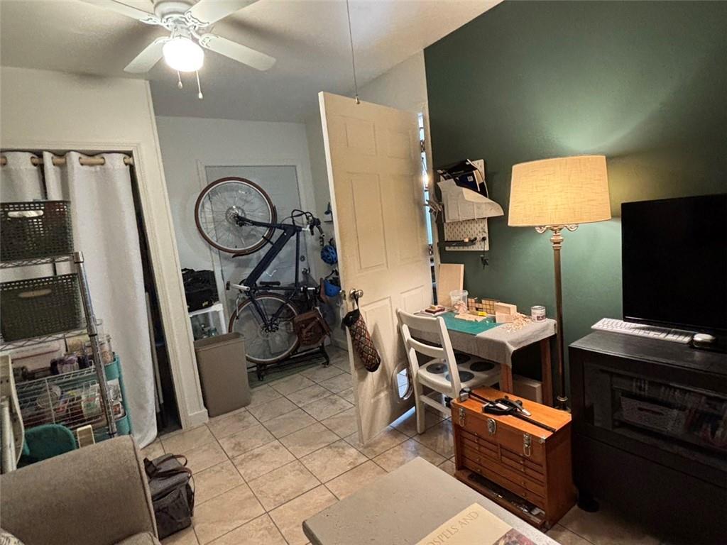 142 Melody Lane Northwest Rome, GA 30165 - Photo 18 of 45 a room with gym equipment and a flat screen tv