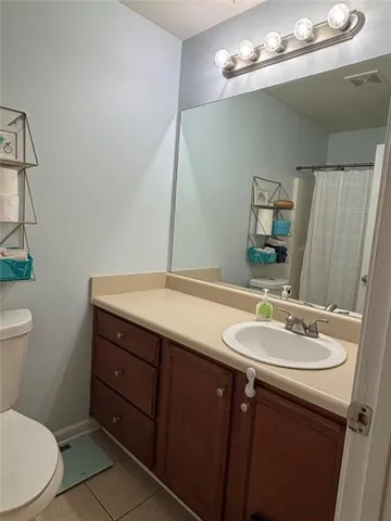 a bathroom with a toilet and a sink