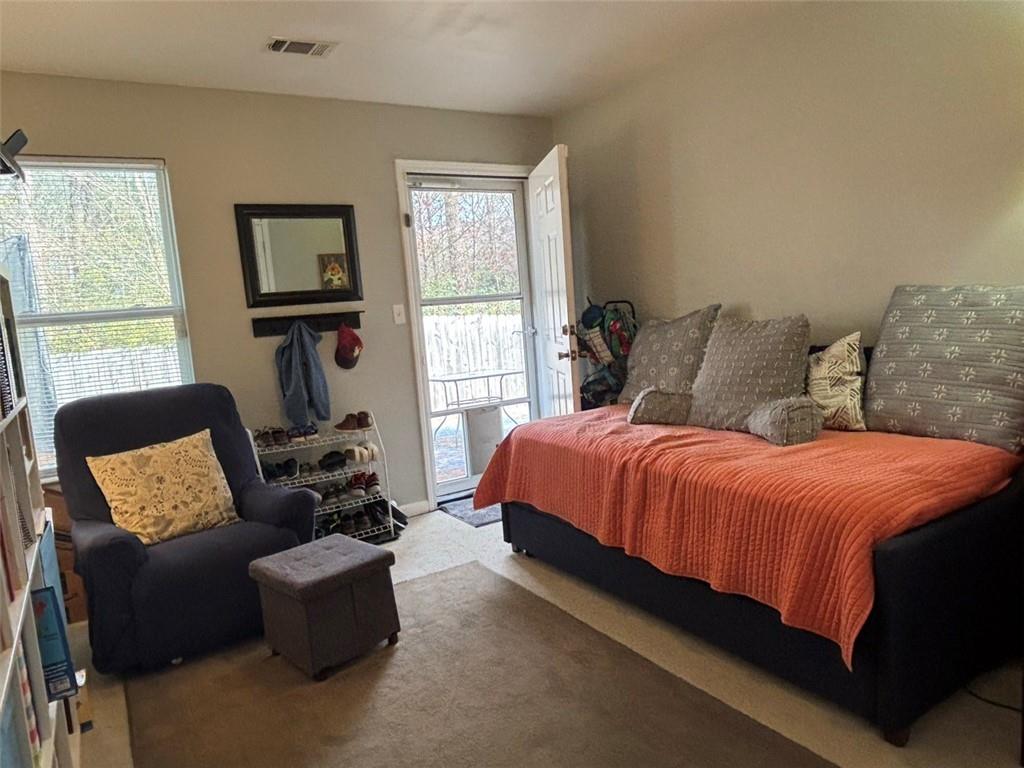 142 Melody Lane Northwest Rome, GA 30165 - Photo 32 of 45 a bedroom with bed couch and window