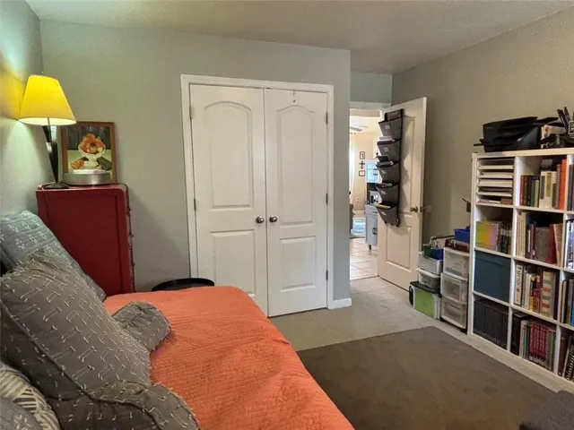 a bedroom with a bed and a table