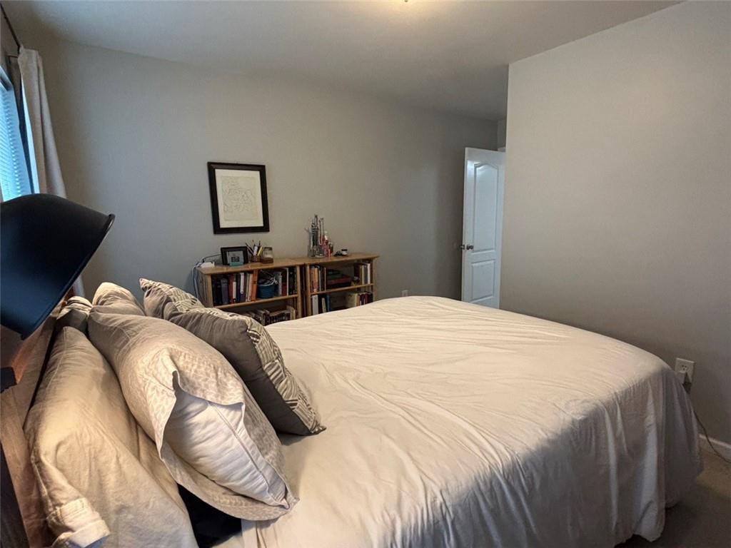 142 Melody Lane Northwest Rome, GA 30165 - Photo 36 of 45 a bedroom with a bed and a painting on the wall