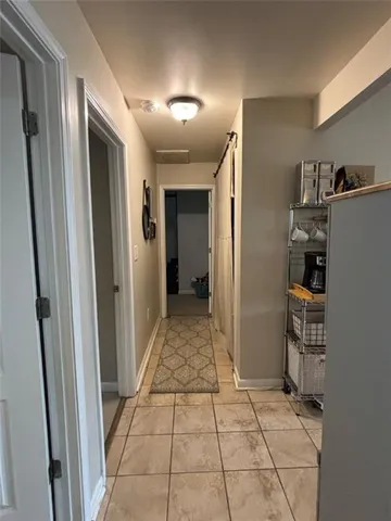 a view of backyard with a chair and tables