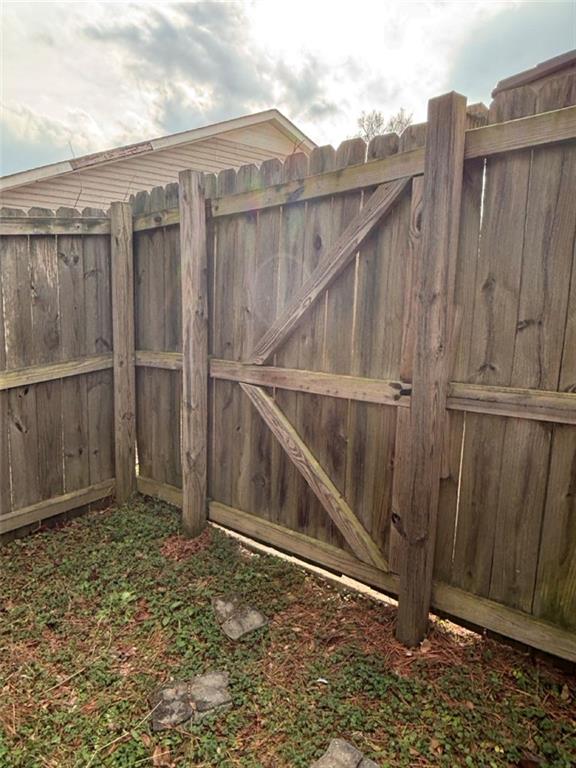 142 Melody Lane Northwest Rome, GA 30165 - Photo 40 of 45 a backyard of a house with wooden fence