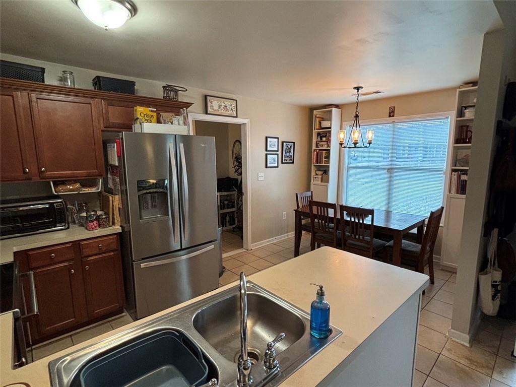 142 Melody Lane Northwest Rome, GA 30165 - Photo 9 of 45 a kitchen with stainless steel appliances a refrigerator and a stove