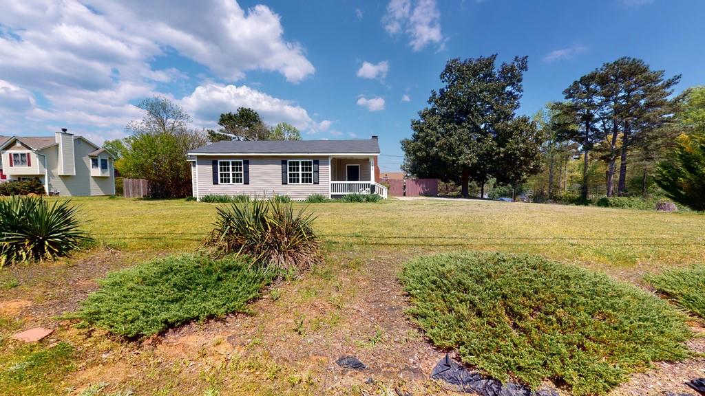 172 Wesley Chapel Road Villa Rica, GA 30180 - Photo 1 of 1 a view of a house with a yard