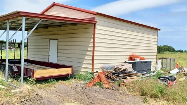 a view of a two chairs in the patio