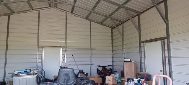 a living room with furniture and hard wood flooring