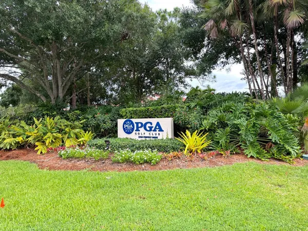 a view of sign board with a yard