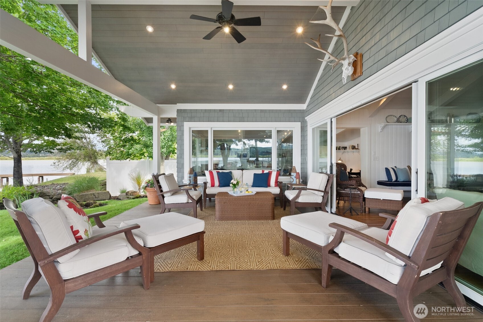 412 Streeter Road Silverlake, WA 98645 - Photo 14 of 40 a outdoor living space with furniture potted plant and a large window