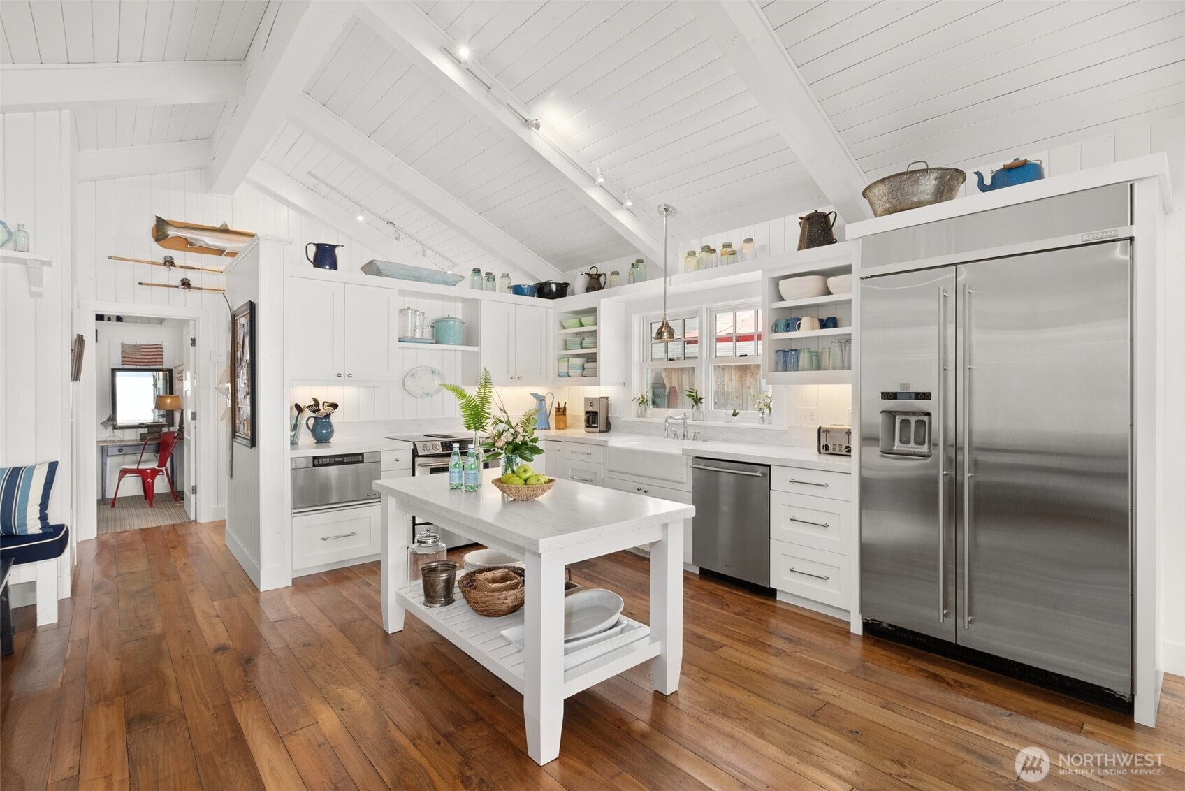 412 Streeter Road Silverlake, WA 98645 - Photo 16 of 40 a kitchen with stainless steel appliances a refrigerator a stove top oven and wooden floors