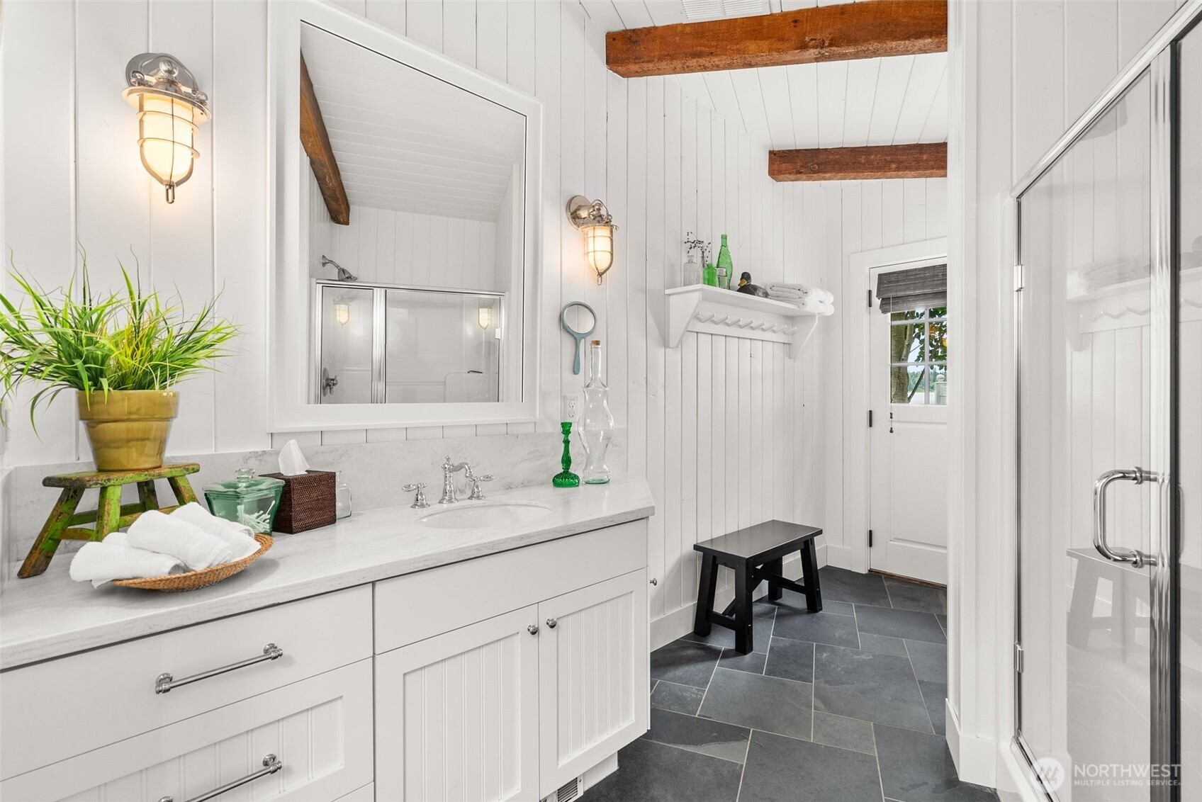 412 Streeter Road Silverlake, WA 98645 - Photo 22 of 40 a en suite bathroom with a granite countertop sink and a mirror