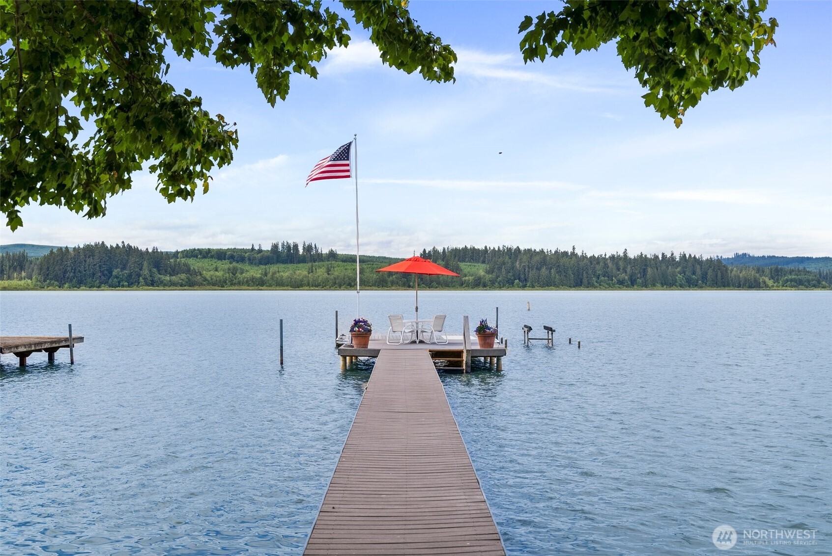 412 Streeter Road Silverlake, WA 98645 - Photo 3 of 40 a lake view with a bench and lake view