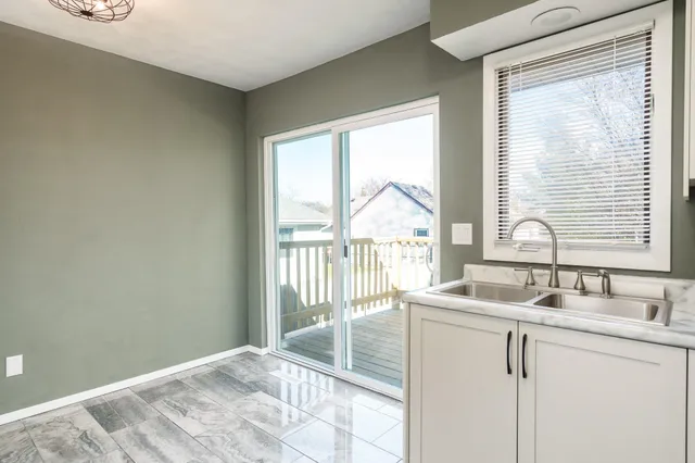 a room with a sink and a window