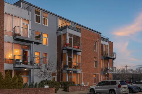 a front view of a building with a street
