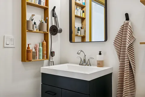 a bathroom with a sink and a mirror