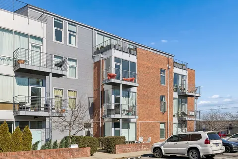 a view of a car park in front of a building